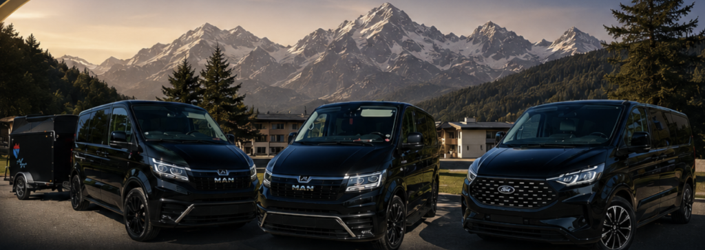 Flotte de trois vans VTC noirs Actiff Transport devant les montagnes des Alpes